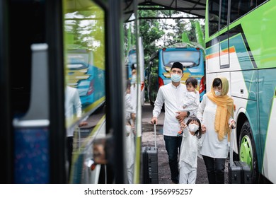 happy asian muslim holiday trip riding a bus together with family wearing mask preventing virus spread - Powered by Shutterstock