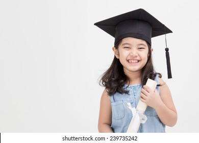 Happy Asian School Kid Graduate In Graduation Cap