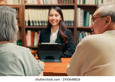 Happy Asian Senior Couple Feel Releif And Pleasant After Get The Advice About Family Financial Planning From Professional Financial Advisor At Home.