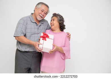 Happy Asian senior couple with gift box isolated on white background. In love, Receiving gifts from lovers. New Year or Christmas concept - Powered by Shutterstock