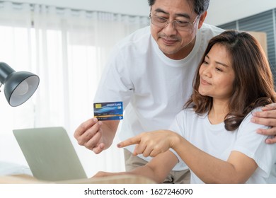 Happy Asian senior couple having good time at home. Old people retirement and healthy citizens elderly concept. - Shutterstock ID 1627246090