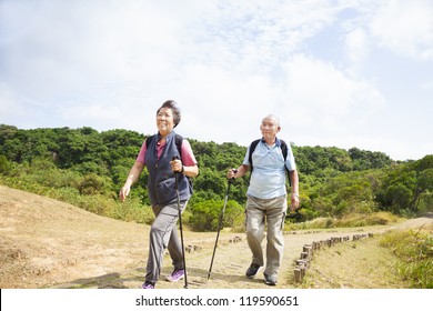 Happy Asian Senior Couple Hiking