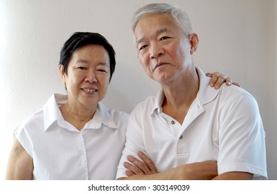 Happy Asian Senior Couple On White Background Love And Hug
