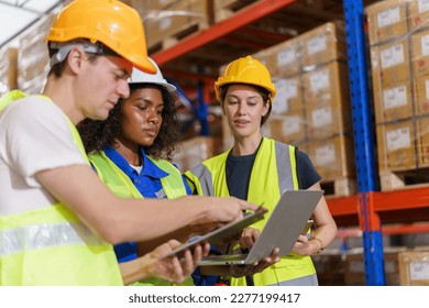 Happy Asian senior supervisor working - inspecting an items in the warehouse, smart and good looking handsome Asian man portrait while working in the warehouse. Warehouse worker working. - Powered by Shutterstock