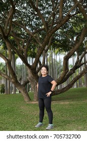 Happy Asian Senior Woman Exercise In The Park.