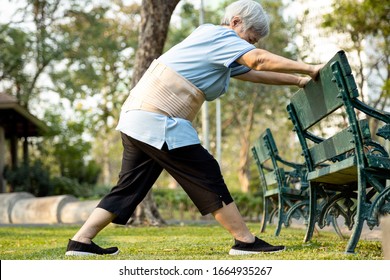 Happy Asian Senior Woman Exercising By Stretching The Leg Muscles,female Elderly Has Lost So Much Weight,excellent Healthy,strong Knee And Bones,health Care,body Balance,good Healthy Lifestyle Concept