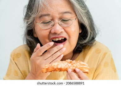 Happy Asian Senior Women Enjoying Eating Pie