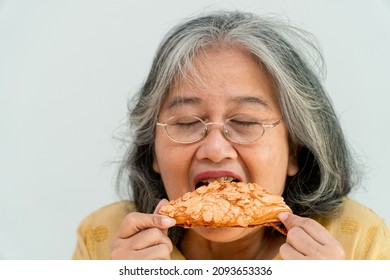 Happy Asian Senior Women Enjoying Eating Pie