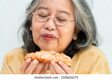 Happy Asian Senior Women Enjoying Eating Pie