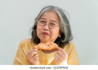 Happy Asian Senior Women Enjoying Eating Pie