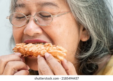 Happy Asian Senior Women Enjoying Eating Pie