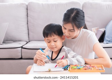 Happy Asian single mother spent time teaching little boy counting numbers by using finger, kid has fun enjoy playing with mom love bonding relationship, homeschool education or motherhood nurturing - Powered by Shutterstock