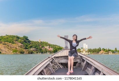 Happy Asian Tourist Girl 45 Years Old Relaxing On Boat Her Arms Open Feeling Freedom Location South Of Thailand As Background.