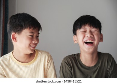 Happy Asian tween boys laughing, Having a great time together, Best Friends Forever
