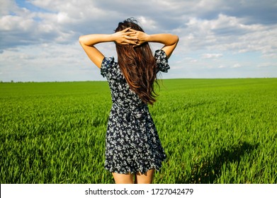 Happy Asian Woman Dancing In Green Field.