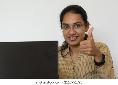 A Happy Asian Woman Employee Or Business Woman In Front Of Laptop. IT, Corporate, Promotion, Job, Switch, Appraisal, Feedback, Manager, Offer Letter, Attrition, Excitement, Resignation, Success, Smile