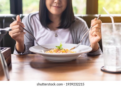 Happy Asian Woman Enjoy Eating With Delicious Food In Restaurant