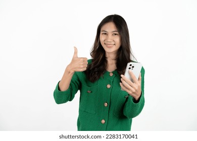 Happy asian woman feeling happiness and standing typing smartphone on white background. - Shutterstock ID 2283170041