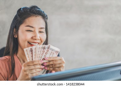 Happy Asian Woman Hand Holding Banknotes ,make Money Online Concept 