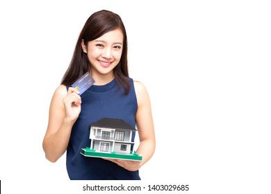 Happy Asian Woman Holding Credit Card And Home Loan, Planning To Take On A Large Loan For Big Purchases House Concept