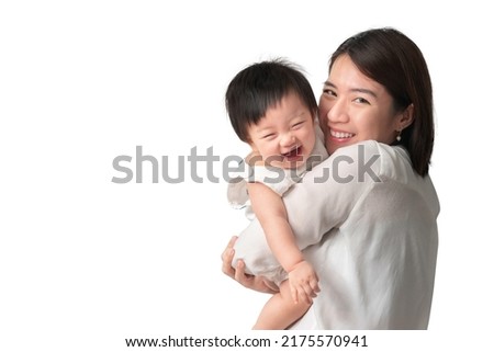 Happy asian woman holding little asian girl with smile, Mother and daughter laughing, isolate on white background, With clipping path.