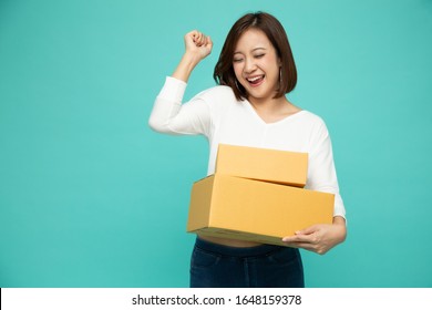 Happy Asian Woman Holding Package Parcel Box, Delivery Courier And Shipment Service Concept