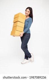 Happy Asian woman holding package parcel box isolated on white background, Delivery courier and shipping service and full body composition concept