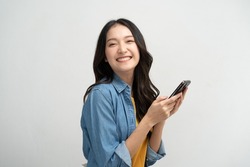 Happy Asian Woman Holding A Smartphone And Winning The Prize.