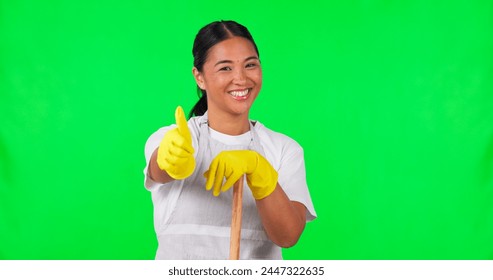 Happy asian woman, housekeeper and thumbs up on green screen for clean hygiene against a studio background. Portrait of female person, maid or cleaner with like emoji, broom or yes sign on mockup - Powered by Shutterstock