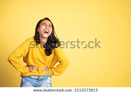 happy asian woman laughing out loud. excited beautiful woman feeling joy on isolated background