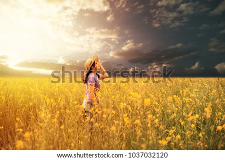 Similar – Image, Stock Photo girl walking in a field with yellow flowers sunny day