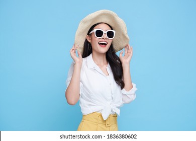 Happy Asian Woman In Summer Casual Clothes Isolated On Blue Backgroud.