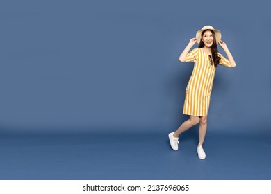 Happy Asian Woman Traveler Standing Isolated On Blue Background, Tourist Girl Having Cheerful Holiday Trip Concept, Full Body Composition