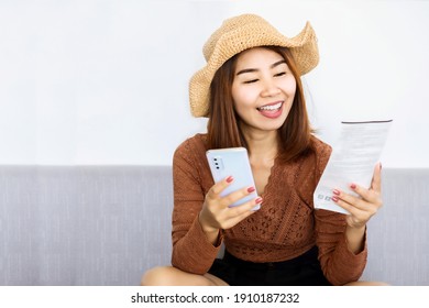 Happy Asian Woman Using Smart Phone Scan QR Code On Electricity Bill To Pay Online ,people With Technology Concept