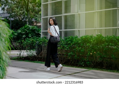 Happy Asian Woman Walking Aa The Park