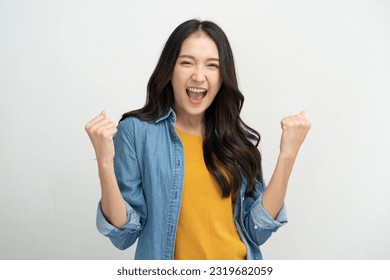 Happy Asian woman winner joying winning the prize. - Shutterstock ID 2319682059
