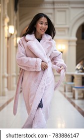 Happy Asian Woman In Winter Coat From Faux Fur, Shop Indoor