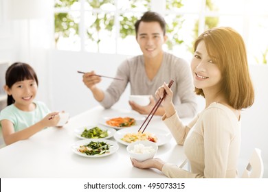 Happy Asian Young Family Enjoy Their Dinner