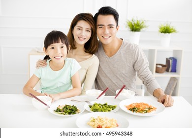 Happy Asian Young Family Enjoy Their Dinner