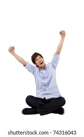 Happy Asian Young Man Sitting And Looking Up