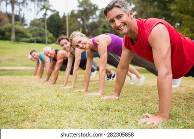 Happy athletic group training on a sunny day - Shutterstock ID 282305858