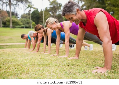 Happy athletic group training on a sunny day - Shutterstock ID 282306731