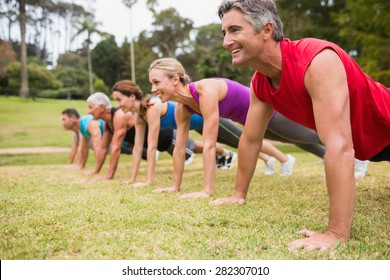 Happy athletic group training on a sunny day - Shutterstock ID 282307010