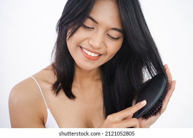 Happy Attractive Asian Woman Brush Her Hair