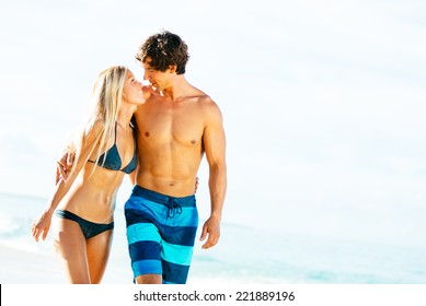 Happy Attractive Couple Walking On Beautiful Sunny Beach   