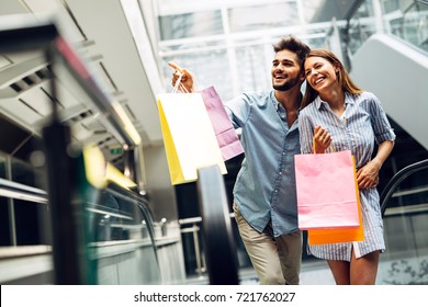 Happy attractive loving couple enjoy shopping together - Powered by Shutterstock