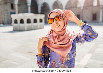 Happy Attractive Muslim Woman Travel In Turkey, Posing In Courtyard Of Suleymaniye Mosque, Religion And Tourist Concept.