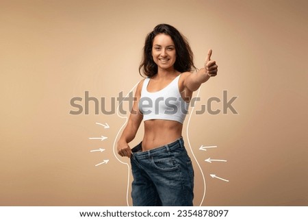 Happy attractive slender young middle eastern woman wearing huge jeans, showing thumb up, results of diet, white body shape lines around happy slim lady, collage for slimming concept, copy space