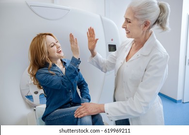 Happy Attractive Woman Giving Her Doctor A High Five