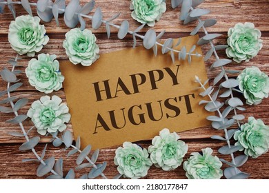 Happy August typography text on paper card decorate with flower on wooden background - Shutterstock ID 2180177847
